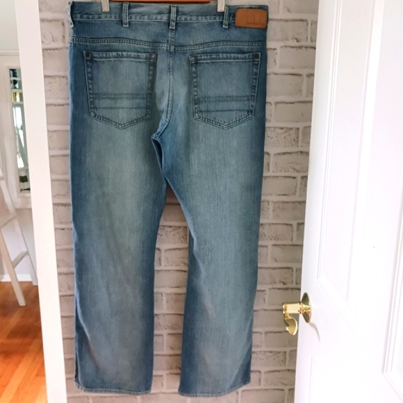 Calvin Klein • Men's Light/Medium Wash Distressed Bootcut Denim Jeans - Picture 2 of 15